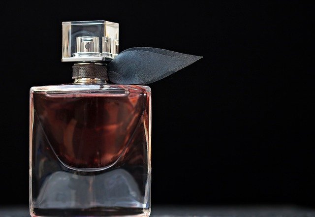bottle-of-perfume-with-black-background-resembling-mercedez-benz