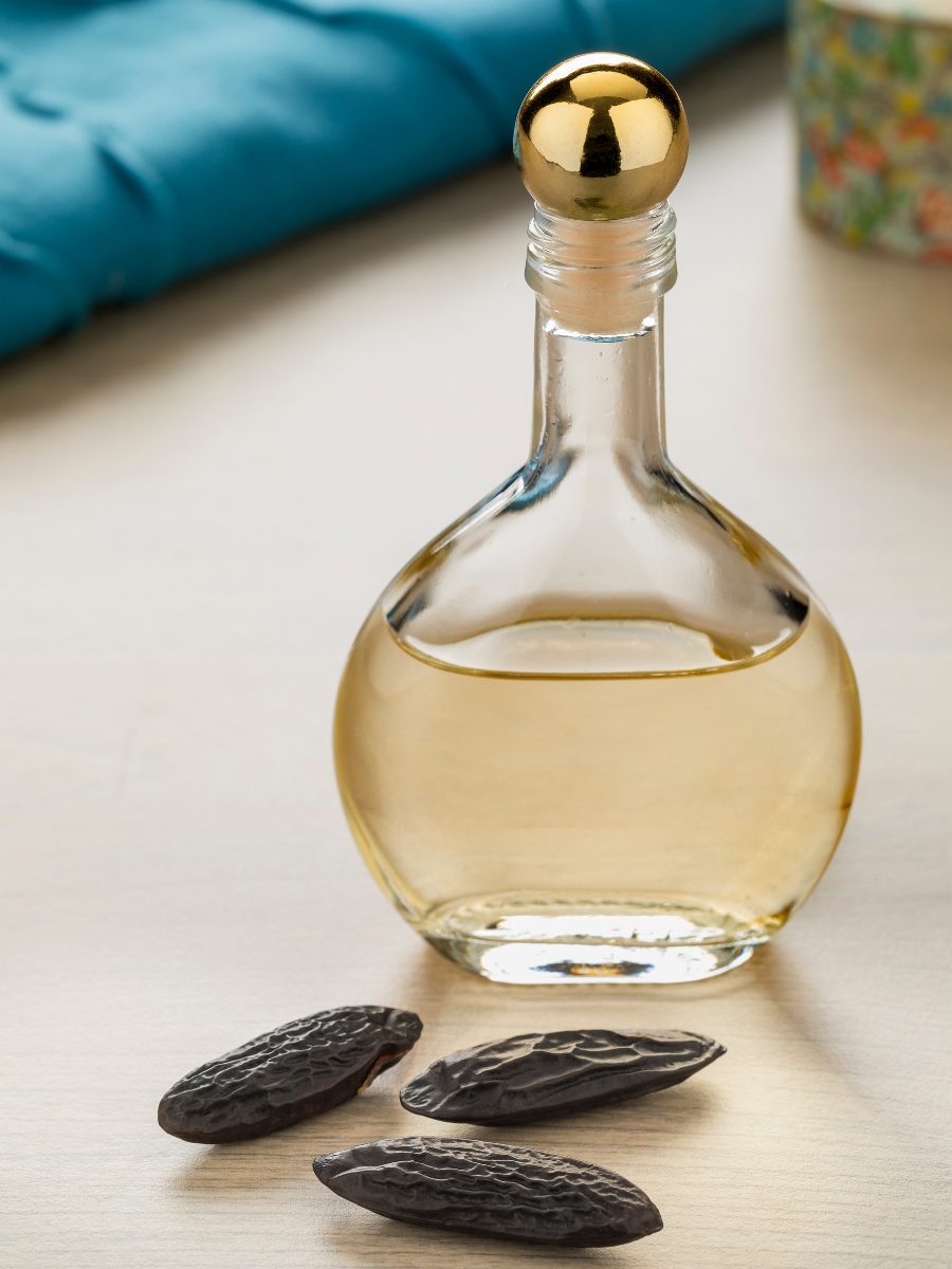 What Does Tonka Bean Smell Like + 5 Best Perfumes To Try Tonka Beans and a bottle of fragrance